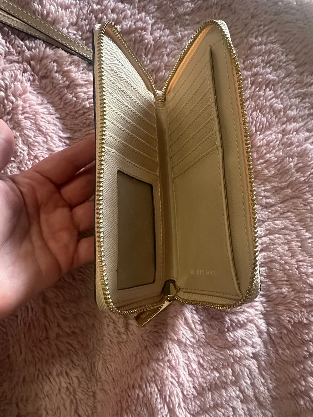 MK wristlet in light tan/ Beige